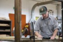 Kent Cook, a historic preservationist for Cuyahoga Valley National Park, works in a maintenance garage in Brecksville on Aug. 28, 2025.