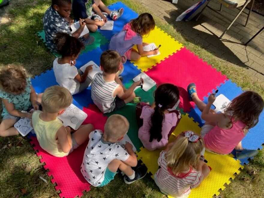 Students drawing creatures.