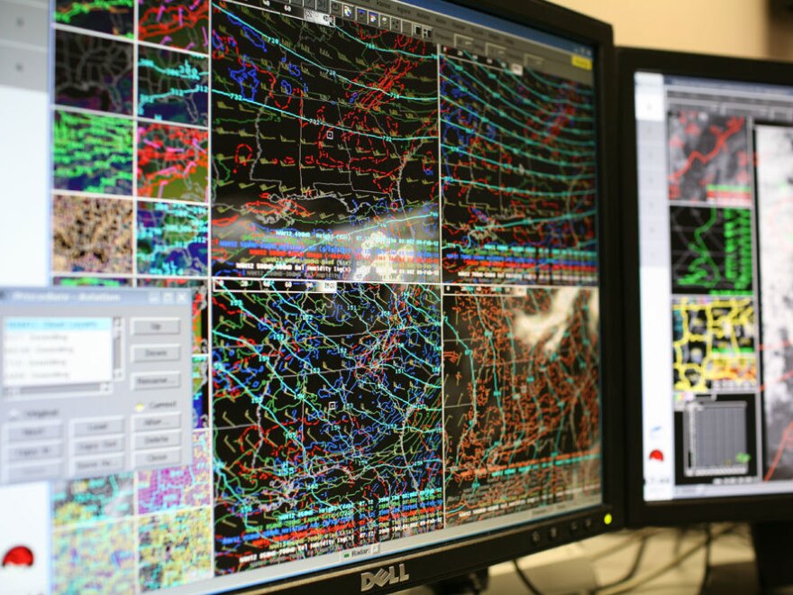 Computer screens at the Birmingham office of the National Weather Service show forecast models. Meteorologists use the information to predict severe weather. During Alabama's tornado outbreak on April 27, 2011, forecasters were forced to take shelter when one of the twisters came close to their offices.