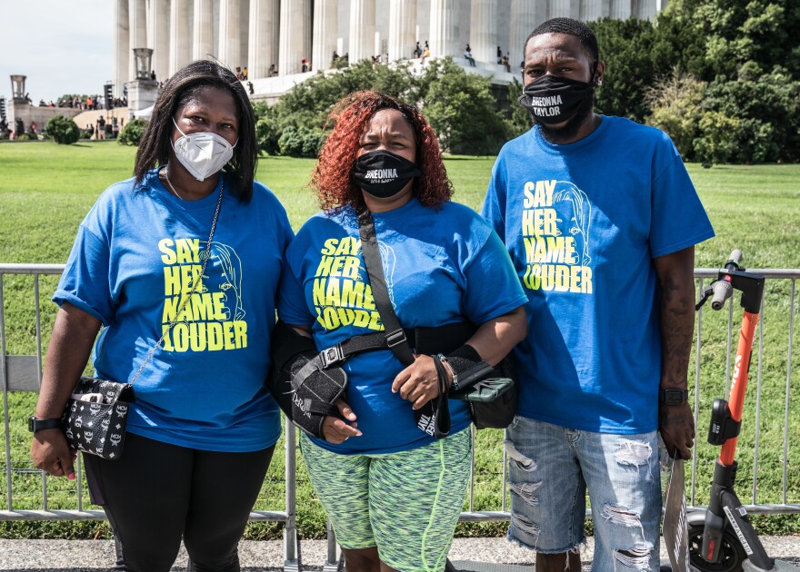 Tamika Palmer, center, mother of Breonna Taylor, was among Friday's speakers.