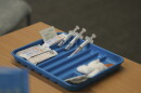 Syringes are prepared for the measles, mumps and rubella vaccine at a clinic in Lubbock, Texas, on Feb. 26, 2025.
