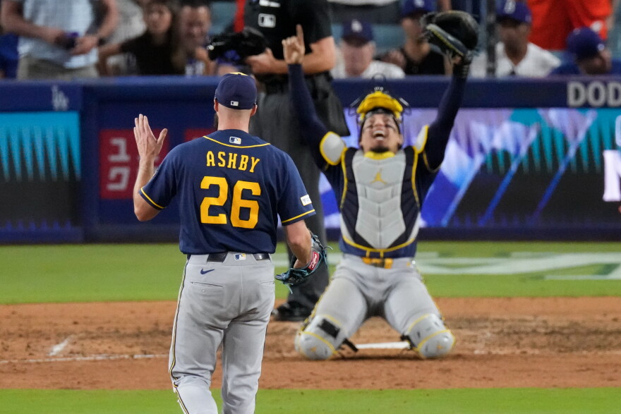 Milwaukee Brewers pitcher Aaron Ashby (26) and catcher William Contreras celebrates after the final out of Game 4 of baseball's National League Championship Series between the Milwaukee Brewers and the Los Angeles Dodgers, Thursday, Oct. 15, 2026, in Los Angeles. (AP Photo/Mark J. Terrill)