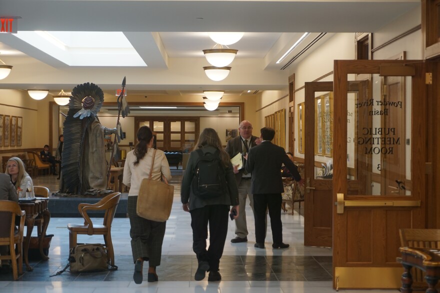 members of the public walking through the Capitol Extension 