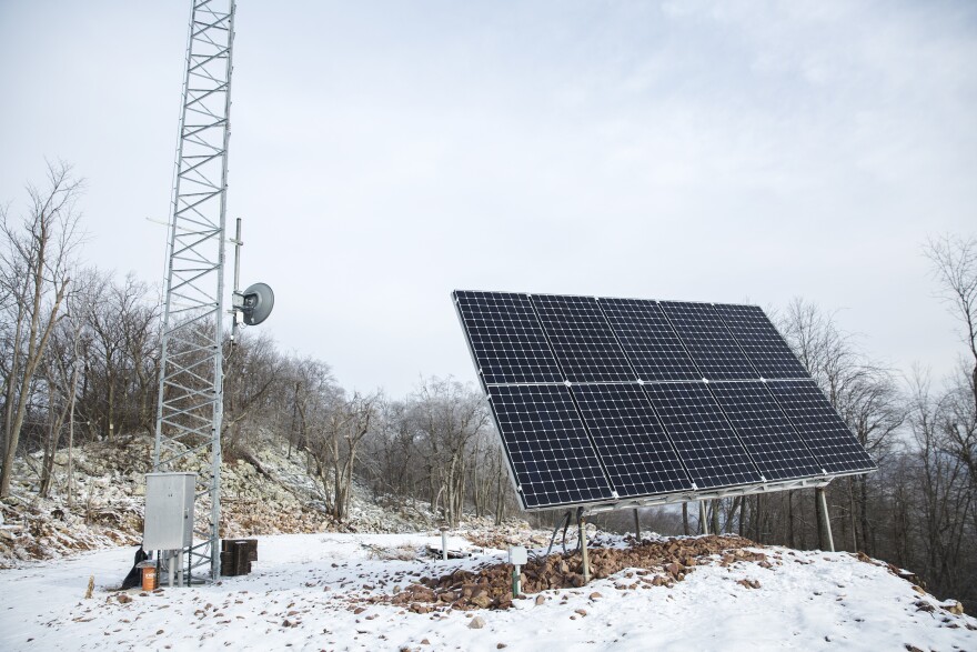 Volunteers bring their trades and skills together to construct the radio tower and solar panels on their own.