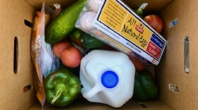 A box of food from Feeding South Florida that was distributed Nov. 18, 2020 at San Lázaro Catholic Church in Hialeah. About 900 people lined up for the food.