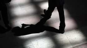 A man walks through the afternoon shadows in New York in 2017. (Timothy A. Clary/AFP/Getty Images)