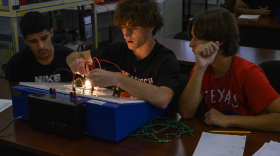 Legacy High School juniors Giovanni Parra, Luke Frysak, and Isaiah Estrada take part in a lesson on electrical circuits during their Oil and Gas Production II class on Nov. 6 in Midland.