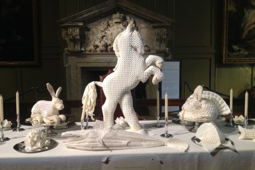 Though today we see these folded sculptures as simple decoration, 16th century guests would have been well aware of the symbolism behind each choice. These examples of napkin art were on display at Hampton Court Palace outside London in 2014.