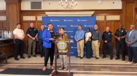 Lexington Mayor Linda Gorton reads the proclamation to Lexington E911 Center director Jonelle Patton