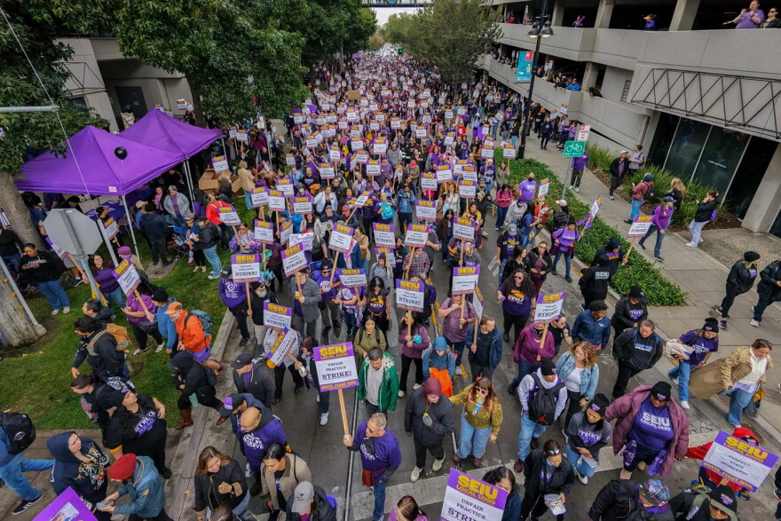 State workers represented by SEIU Local 1000 strike outside the CalHR building in Sacramento on Oct. 21, 2026. 