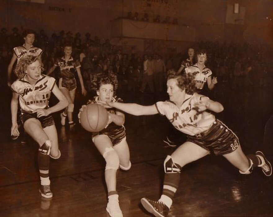 Hanes Hoisery star Eckie Jordan chases the ball in a game with Iowa Wesleyan College, 1950s.