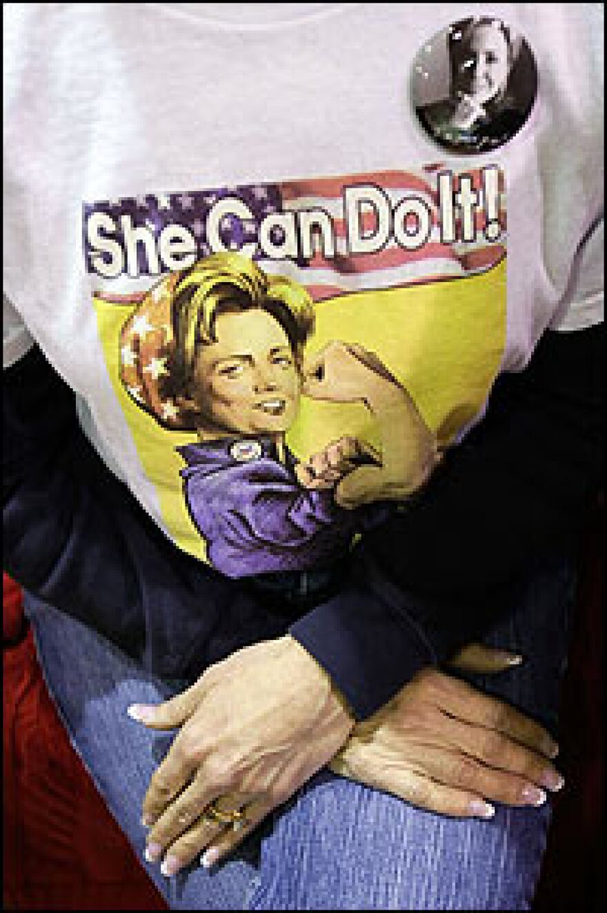 Maryland voter Susan Lower wears a T-shirt featuring Democratic presidential hopeful Sen. Hillary Clinton, as she waits for Clinton's arrival at a town hall meeting in Manassas, Va.