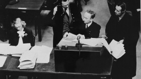 Chief prosecutor Benjamin Ferencz presents documents as evidence at the Einsatzgruppen Trial. 