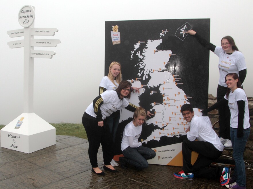 In a 2011 torch relay before the 2012 Olympic Games, 15-year-old Mhairi Gifford from Shetland points to the box.