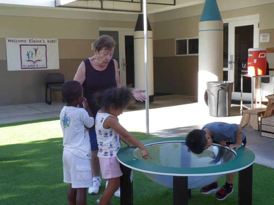 Connie Vermette, a teacher at Children First in Sarasota, plays outside with her students on Sept. 9, 2026.