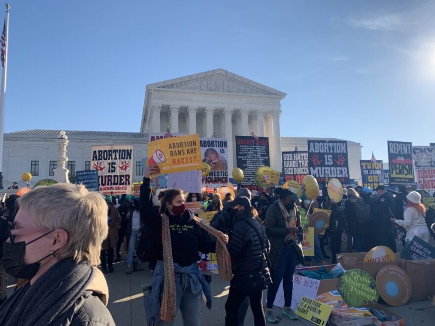 In this 2021 file photo, demonstrators gather outside the U.S. Supreme Court as justices hear arguments in a Mississippi case that seeks to overturn Roe v. Wade. (Jane Norman/States Newsroom)