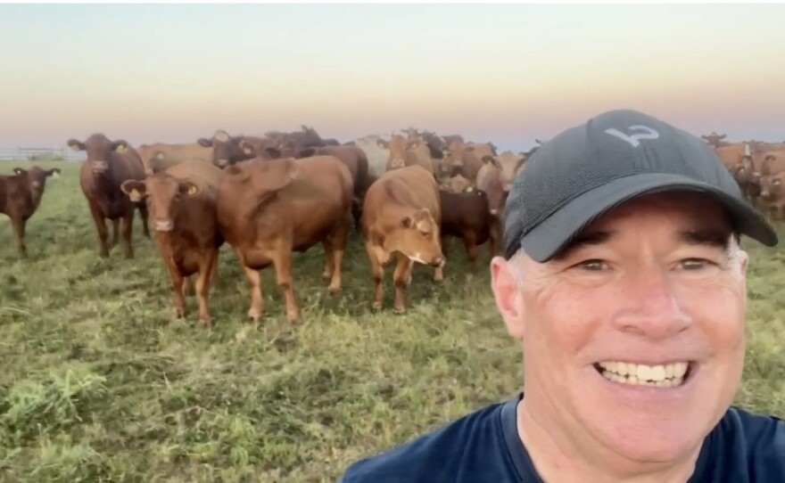 Darren Kittleson of Generations beef poses with the Akaushi cows