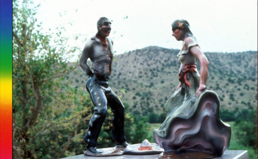 Titled "Fiesta Dancers" (1985) this fiberglass sculpture by Luis Jimenez depicts a man and woman dancing the Jarabe Tapatío (Mexican Hat Dance). A sombrero has been thrown on the ground between them.