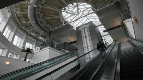 A passenger rides an escalator to terminal A at the Cincinnati/Northern Kentucky International Airport.