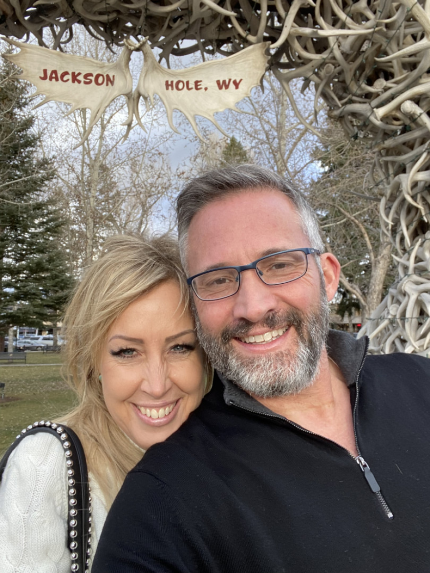 A selfie of a man and woman smiling.