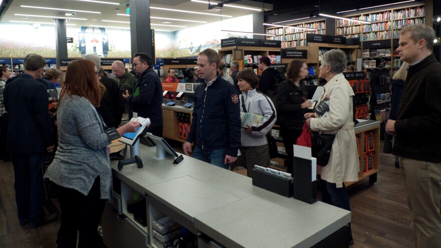 Proceed to checkout: At its new bookstore, Amazon's customers lined up to buy books in Seattle Tuesday.