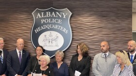 Sandy Carmichael speaking with Albany law enforcement officials