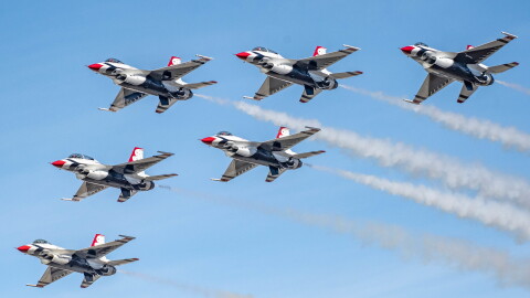 Members of the United States Air Force Air Demonstration Squadron "Thunderbirds" perform a high show demonstration in Reno, Nevada, September 19, 2021. Six plans fly in a "V" formation against a blue sky.