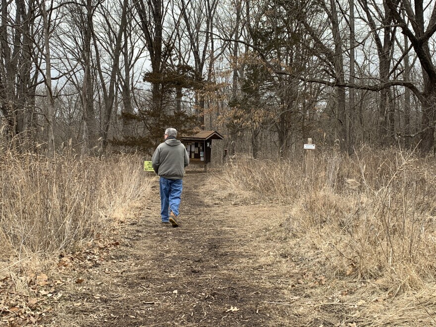 Bill Mees walking towards the CANS trailhead kiosk in Columbia, MO on Feb. 26.