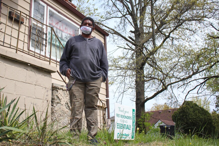 Stephen McBride displays a Black Lives Matter flag alongside a yard sign expressing solidarity with first responders. "A lot of people would say that us Black people hate the police and hate anyone in public service, and that's not true," he said.