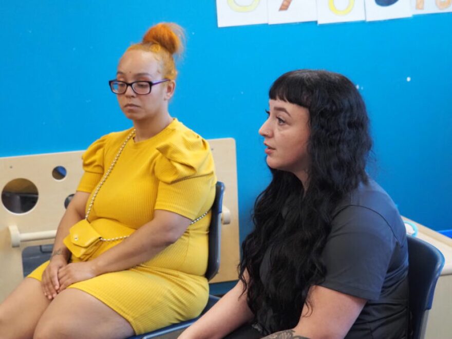 Jasmine Williams, left, and Kendra Chavez talk to Gov. Mike Braun about the significance of low-income childcare aid during his visit to Shepherd Community Center’s Minnie Hartmann Neighborhood Childcare facility on Tuesday, July 21, 2026.