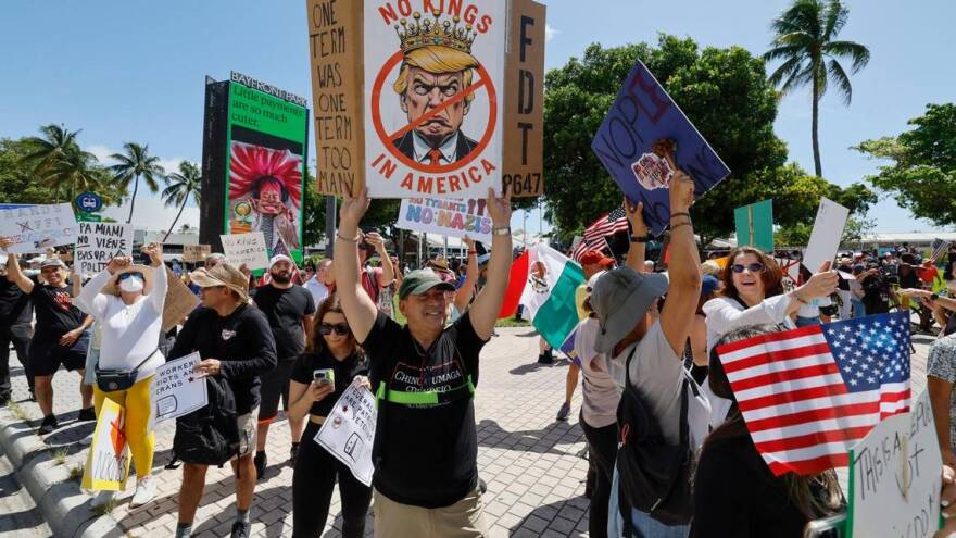 Hundreds gather around the Torch of Friendship in downtown Miami as part of the nationwide "No Kings" protests against the Trump administration on Saturday, June 14, 2025.