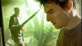 A scene in which Tom Cruise, foreground, and Tim Robbins struggle silently for control of a shotgun is an emotional watershed, David Edelstein says. 