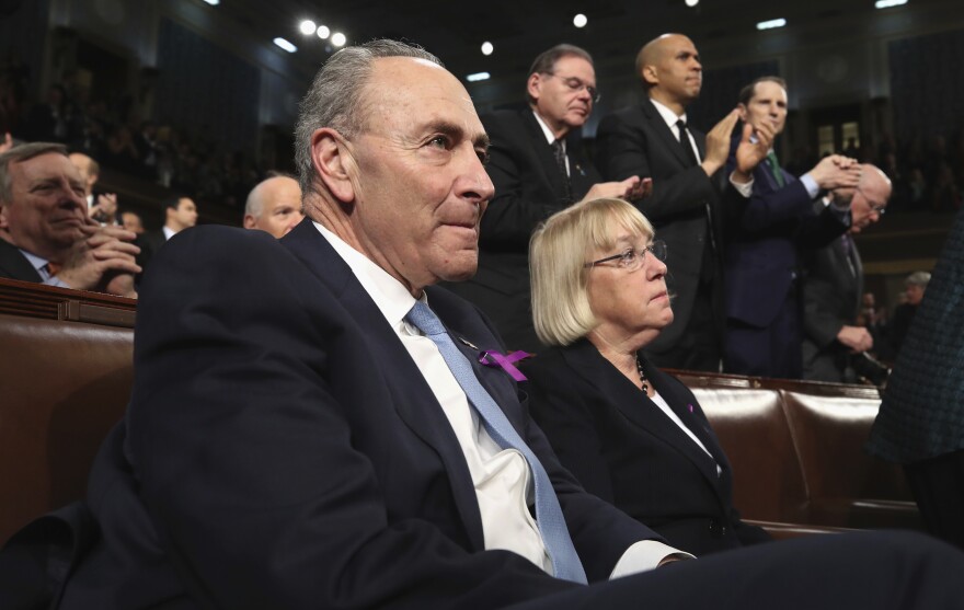 Democratic Sens. Chuck Schumer of New York and Patty Murray of Washington state listen to the president's address.