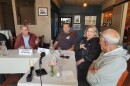 Senator Jeff Merkley, left listens to Crossroads Farm owner Ben Tilley, Kiva Grocery owner Melissa Brown and Cafe Soriah owner Ibrahim Hamide, at an affordability roundtable at Cafe Soriah in Eugene on June 5, 2026.