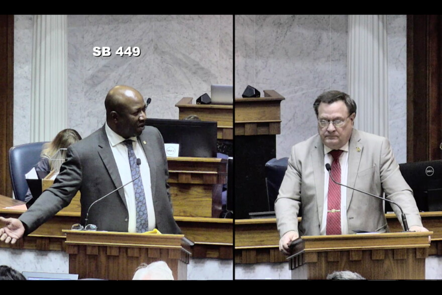 Sen. Greg Taylor (D-Indianapolis), left and Sen. Mike Young (R-Indianapolis) debate the juvenile sentencing bill on the Senate floor.