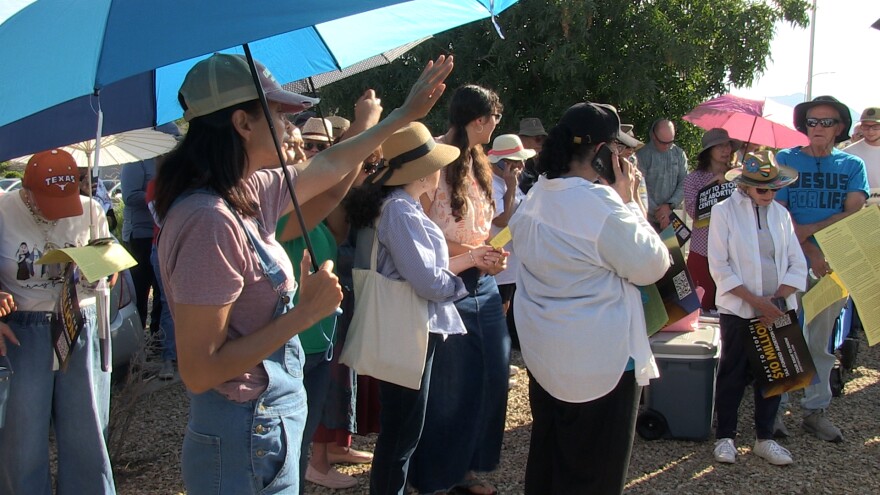 Anti-abortion rights protesters pray before marching.