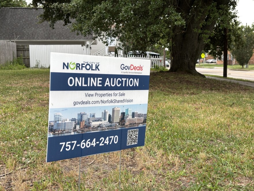 An auction sign on the vacant lot with a live oak tree in Norfolk's Park Place, on June 16, 2026. The sign has since been removed.