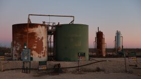 MIDLAND, TEXAS - MARCH 12: Storage tanks that are part of a system for holding waste water and crude oil are seen as companies drill for oil in the Permian Basin oil field on March 12, 2022 in Midland, Texas. President Joe Biden imposed a ban on Russian oil, the world’s third-largest oil producer, which may mean that oil producers in the Permian Basin will need to pump more oil to meet demand. The Permian Basin is the largest petroleum-producing basin in the United States.