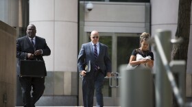 Bill Miller, center, Steve Stenger's former chief of staff, walks out of federal court Friday after being sentenced to 15 months in prison.