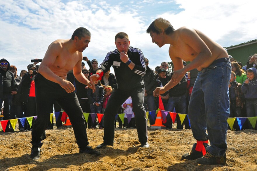 Andy Piscoya (right) faced Russian musher, Michael Telpin (left) during the innaugural Beringia Arctic Games. (Photo by Emily Schwing, KUAC - Fairbanks)