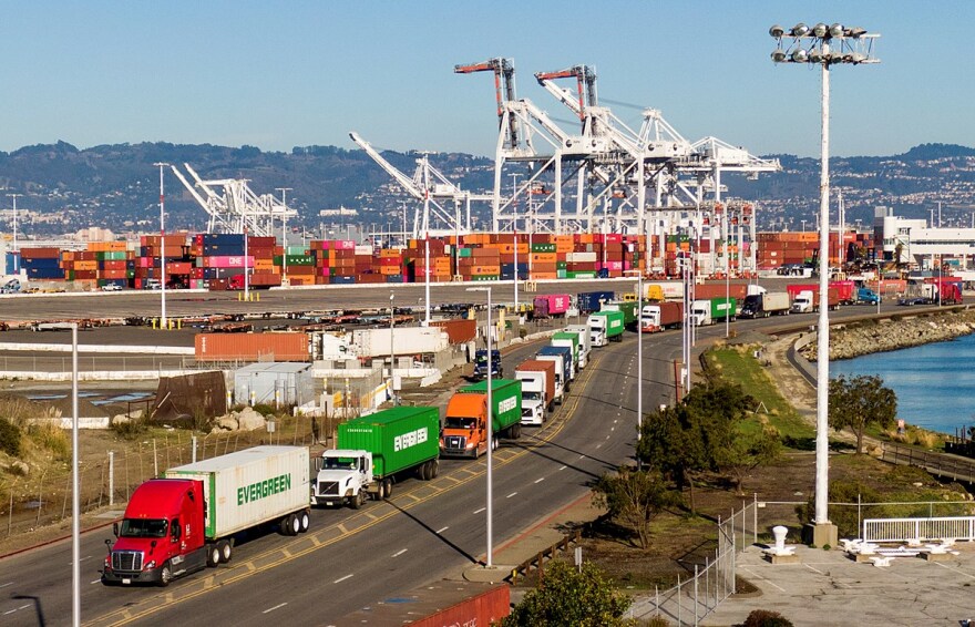 Trucks line up to enter a Port of Oakland shipping terminal on Nov. 10, 2021, in Oakland, Calif.