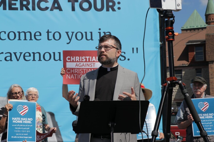 The Rev. Nathan Empsall speaks outside First Baptist Church in Batavia Aug. 12, 2022, to denounce the ReAwaken America Tour and Christian nationalism.