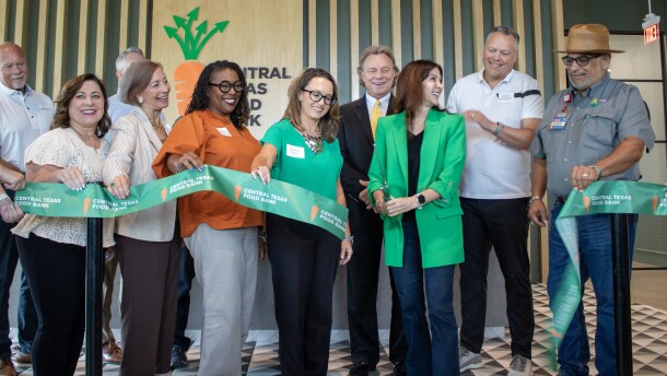 Central Texas Food Bank President and CEO Sari Vatske, center, celebrates with members of the board and City of Waco officials after the ribbon cutting for the new Waco Food Hub at 1402 Gholson Road. The ribbon cutting ceremony on Tuesday, August 24 marked the facility's official opening.