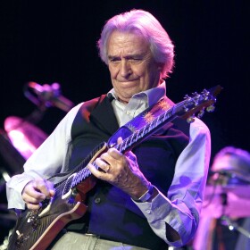 John McLaughlin, an English guitarist and leading jazz musician, performs in the Universal Hall in Skopje, Macedonia, Saturday, Nov. 22, 2014. McLaughlin performed Saturday with his 4th Dimension fusion quartet. (AP Photo/Boris Grdanoski)
