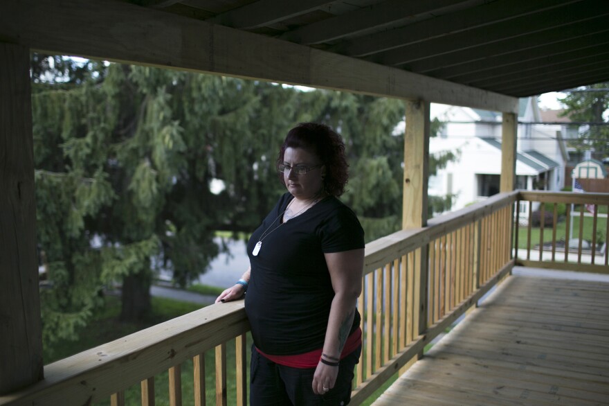 Kelly Clixby stands outside of her home in Marion. Kelly is a recovering addict who was been clean since last October.