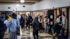 After roll call, tenants, landlords and attorneys meet outside the courtroom.