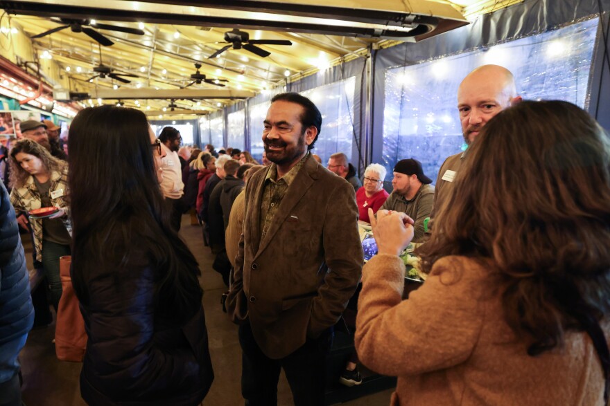 Sandeep Srivastava chats with residents during a Collin County Democratic Party happy hour on Jan. 19, 2024, at Blue Goose Mexican Restaurant in McKinney.