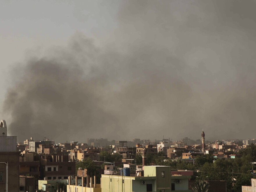 Smoke rises in Khartoum, Sudan, on Saturday as gunfire and heavy artillery fire continued despite the extension of a cease-fire between the country's two top generals.
