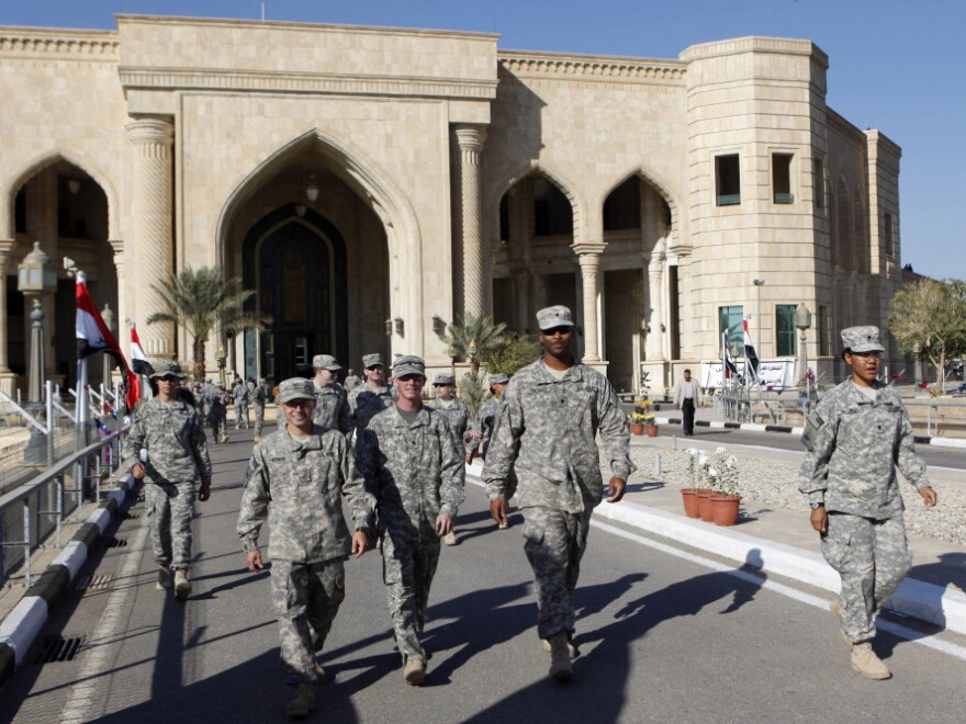 U.S. troops leave Al Faw palace at Camp Victory in Baghdad earlier this month. The complex was a significant point of logistics for the Iraq War and was recently transferred to <a href="http://www.npr.org/2011/12/02/143038873/icon-of-u-s-military-now-in-iraqi-hands">Iraqi control</a>.