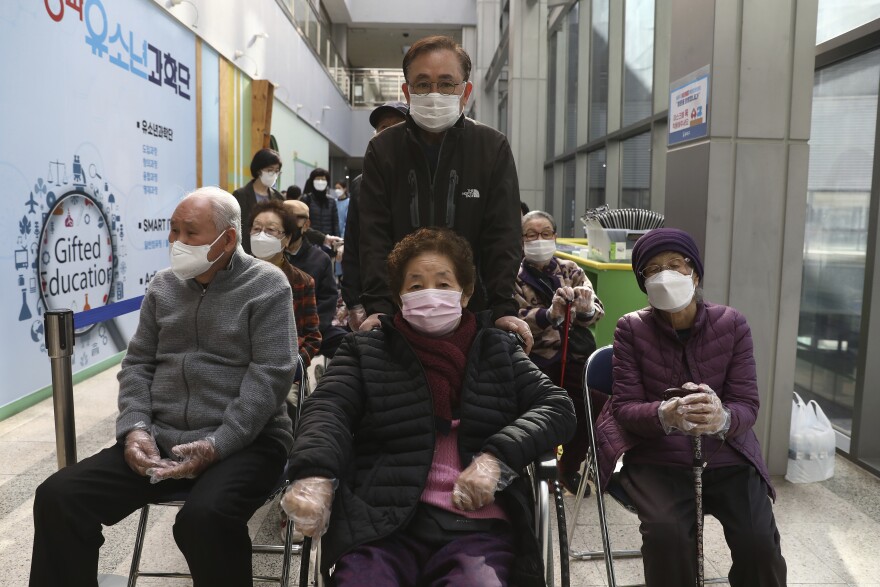 South Korean elderly people wait to receive the first dose of the Pfizer-BioNTech COVID-19 vaccine at a vaccination center in Seoul, South Korea, Thursday, April 1, 2021. South Korea started its coronavirus vaccination for senior citizens over 75 years old. (Chung Sung-Jun/Pool Photo via AP)